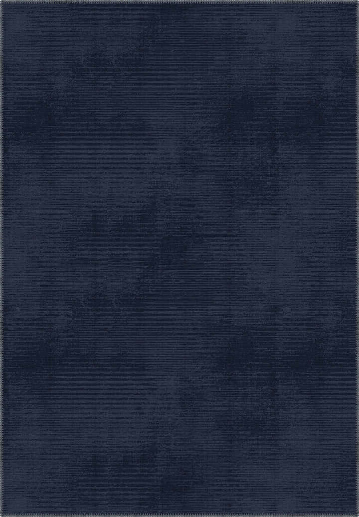 Navy blue rug with a subtle pattern in midnight blue tones.