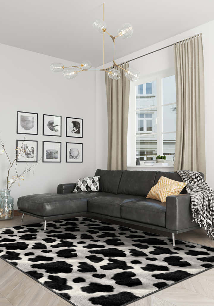 cowhide rug with grey sofa