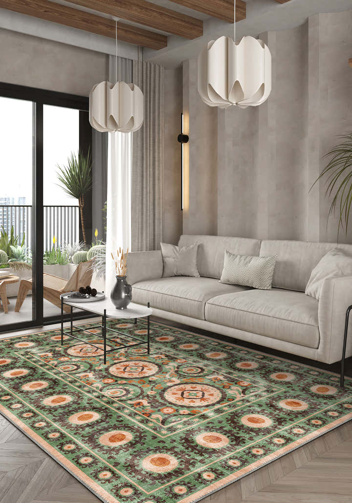 Green bohemian rug with Suzani motifs.