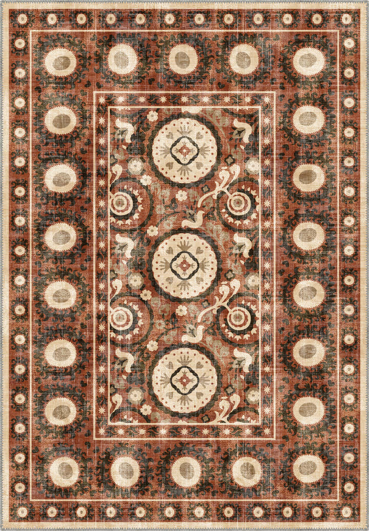 Bohemian terracotta rug with suzani motifs.